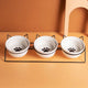 Triple Slanted Ceramic Pet Bowl Set with Elevated Iron Stand and Non Slip Base - 3 x 300ML Versatile Black Cat Paw Print Pattern Dishes for Water & Food