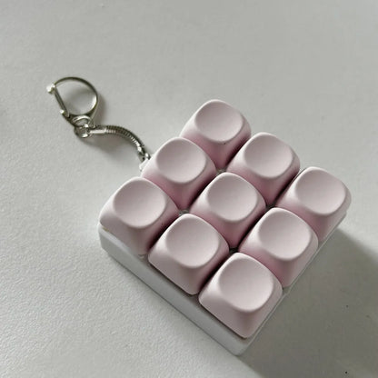 2-Pack Light Pink Mechanical 9-Keyboard Fingertip Toy Keychain - Key Pressure Relief, PVC Fingertip Toy - Mekamart Australia